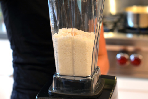 The ingredients for homemade coconut butter are placed in a Vitamix blender.