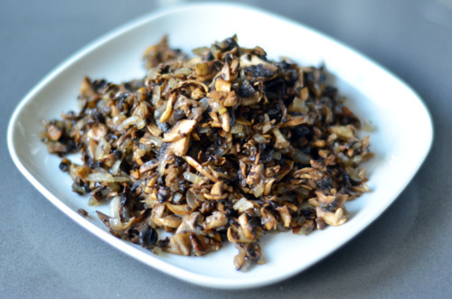 Sautéed cremini mushrooms on a plate.