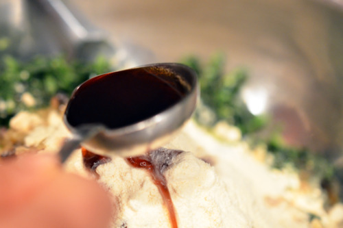 Coconut aminos are added to the bowl with the pork slider ingredients. 
