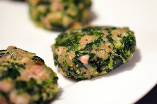 Small 2-inch green pork sliders are formed into patties, ready to be cooked.