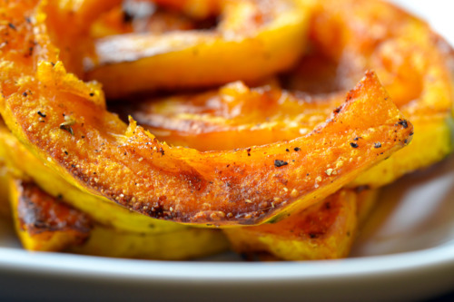 A closeup shot of Roasted Kabocha Squash on a white platter
