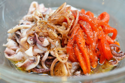 A bowl of the flash cooked calamari and grilled peppers.