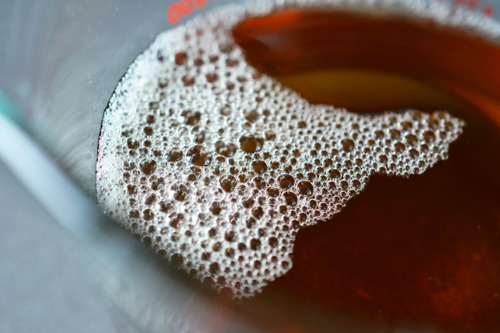 Bacon grease in a glass measuring cup.