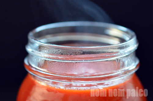 Paleo Sriracha transferred to a mason jar.