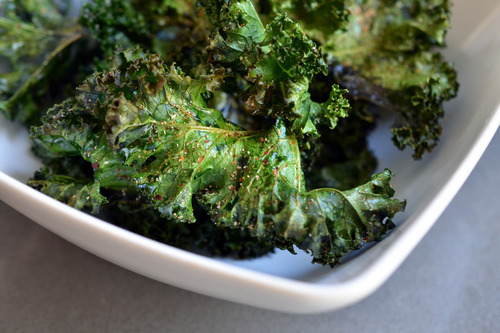 A bowl of baked kale chips. A tasty, healthy homemade snack that's Whole30-friendly, Paleo, keto, and low carb!